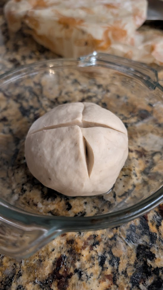 Madre after 5:30am feed, cross-scored and domed in glass bowl